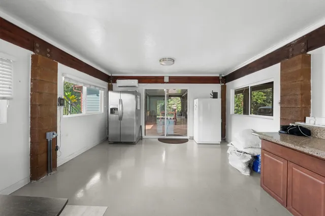 a bathroom with a sink mirror and a shower