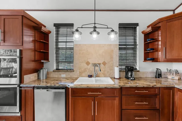 a kitchen with a sink and cabinets