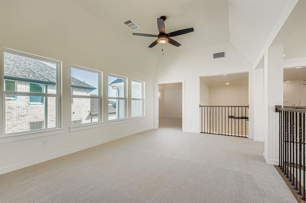 2651 Merrell Court Prosper, TX 75078 - Photo 24 of 28 an empty room with ceiling fan and windows