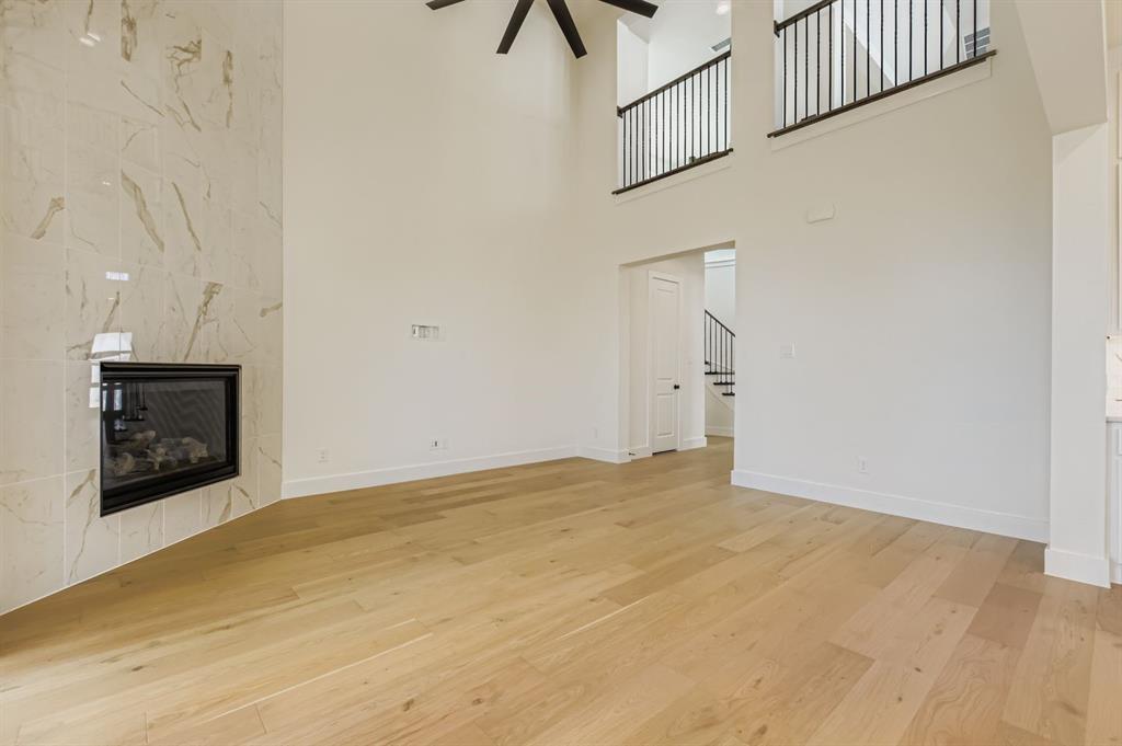 2651 Merrell Court Prosper, TX 75078 - Photo 5 of 28 a view of an empty room with a fireplace