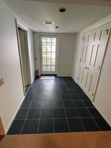 a view of an empty room with a window