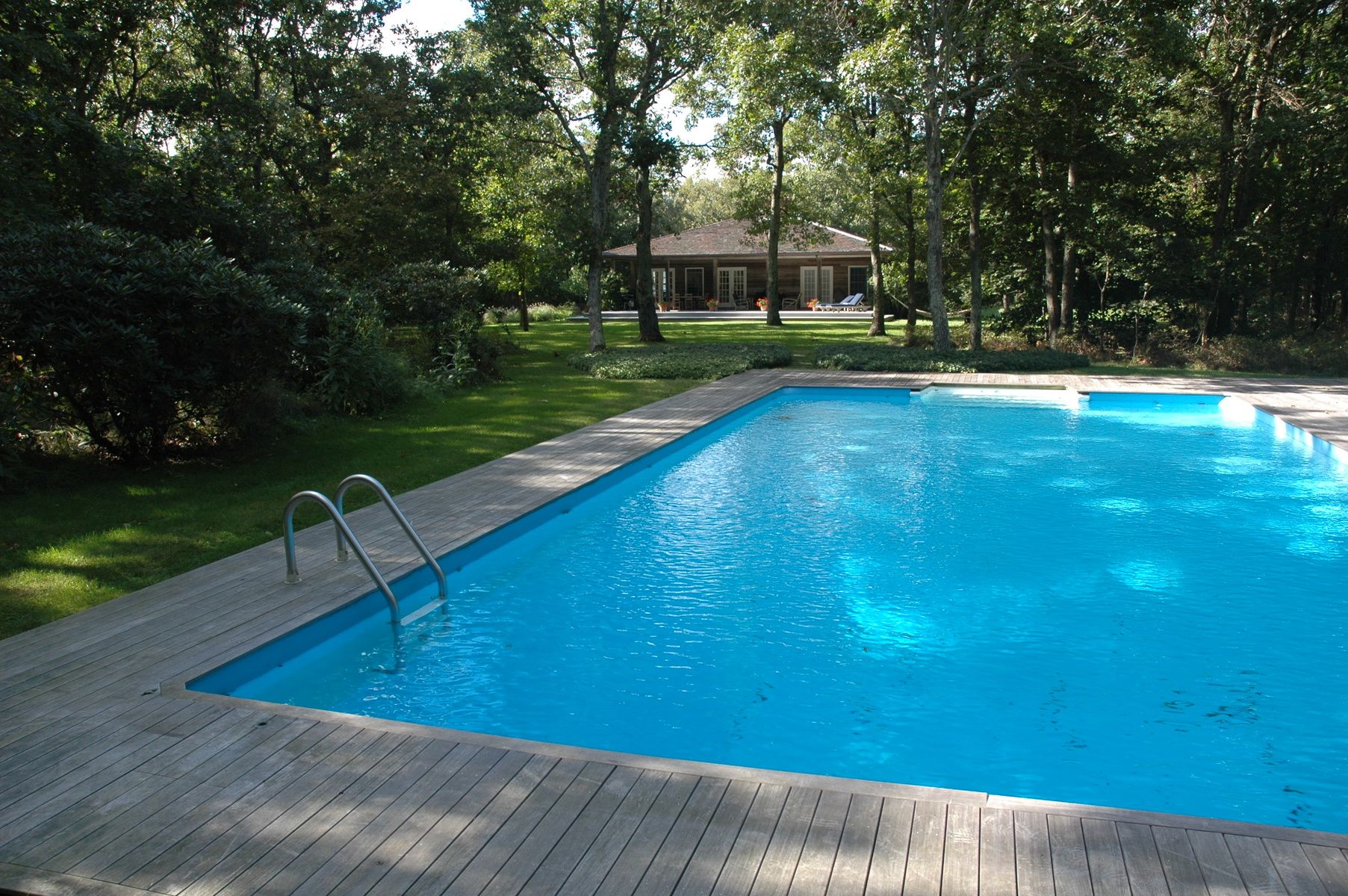 Undisclosed Address East Hampton, NY 11937 - Photo 3 of 14 a view of a swimming pool with a patio