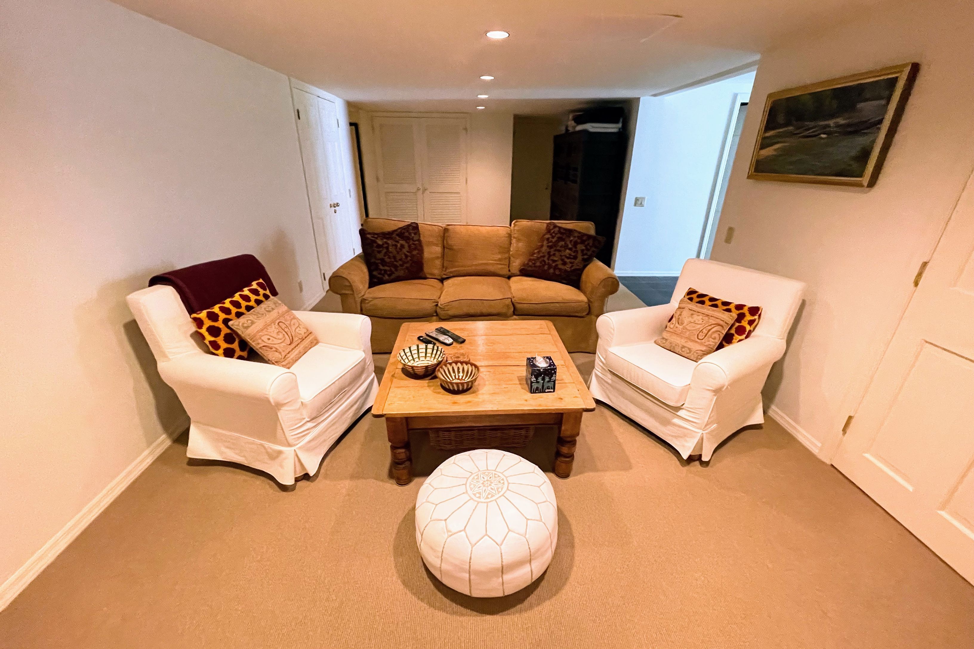Undisclosed Address East Hampton, NY 11937 - Photo 9 of 14 a living room with furniture and a flat screen tv