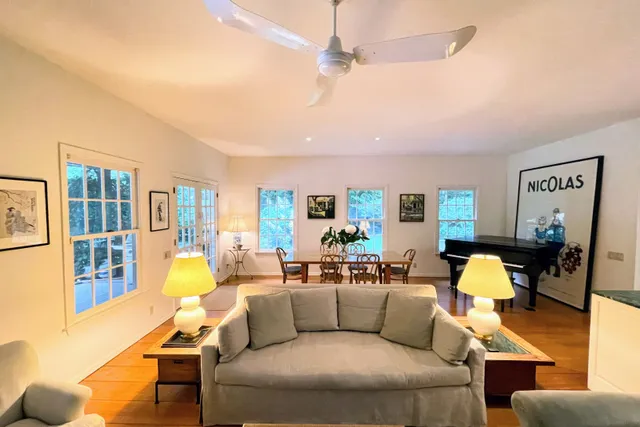 a living room with furniture and a lamp
