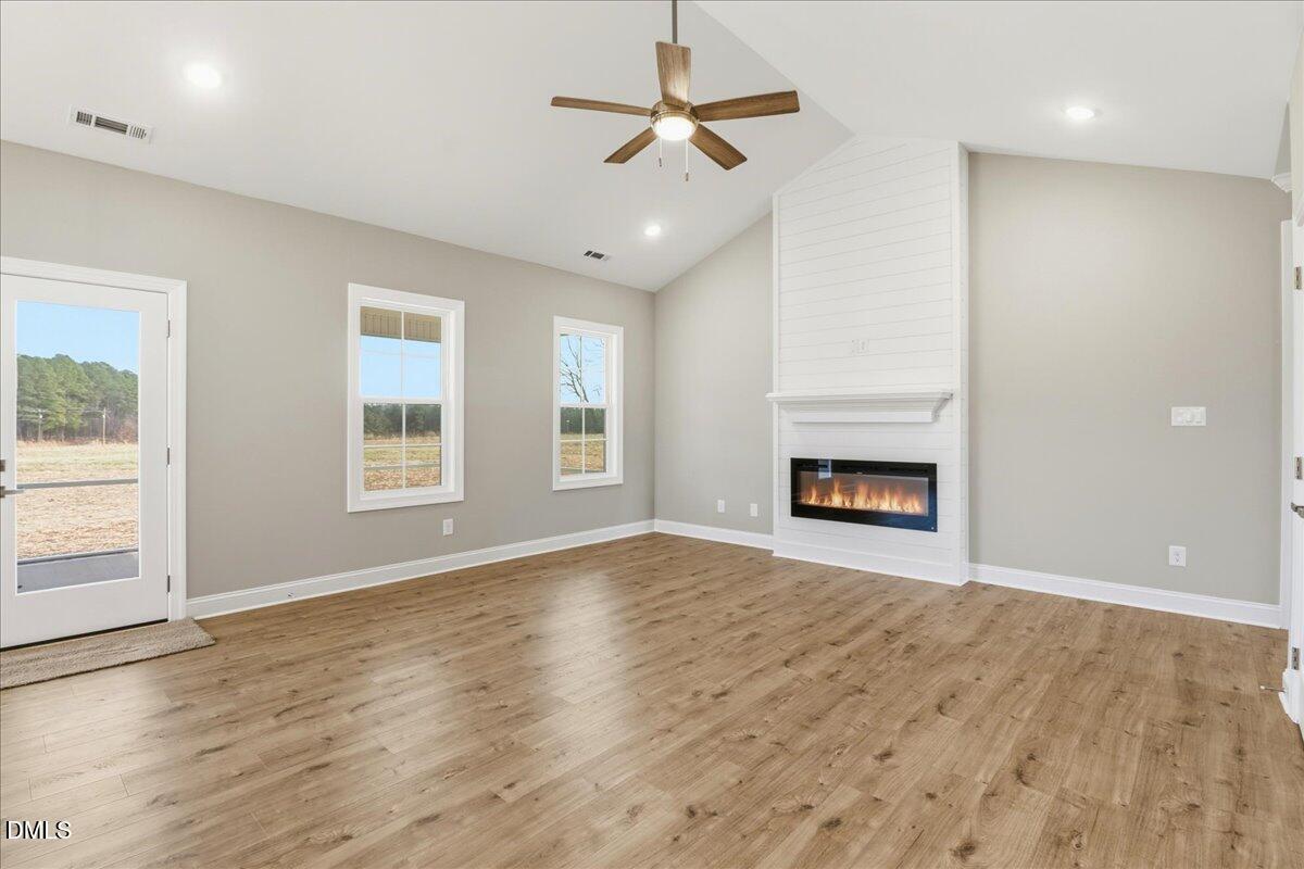 1345 Scarlet Oak Rd Spring Spring Hope, NC 27882 - Photo 12 of 23 an empty room with windows and fireplace