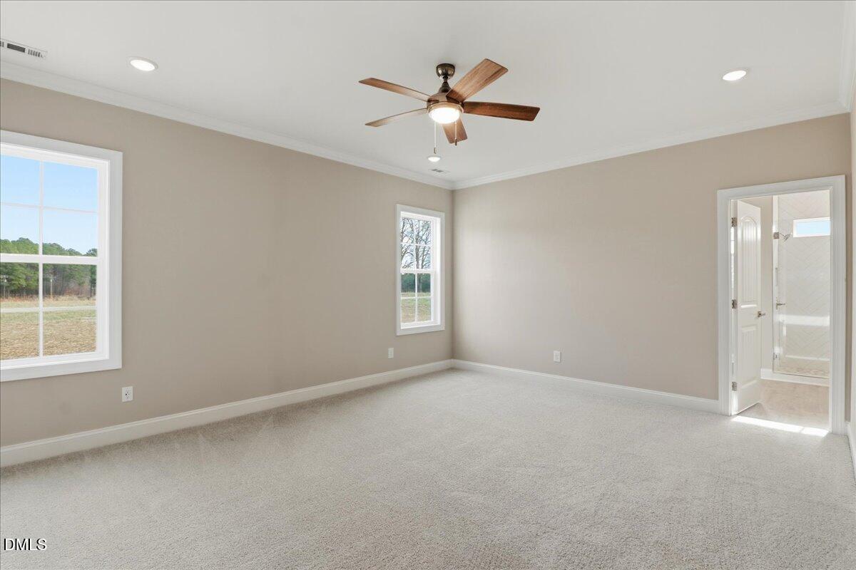 1345 Scarlet Oak Rd Spring Spring Hope, NC 27882 - Photo 13 of 23 an empty room with window and ceiling fan