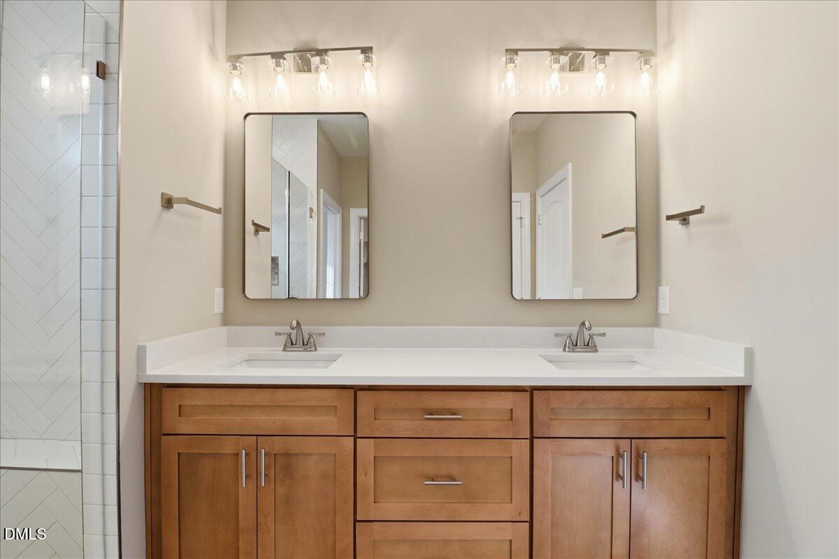 1345 Scarlet Oak Rd Spring Spring Hope, NC 27882 - Photo 14 of 23 a bathroom with double vanity sinks and a mirror