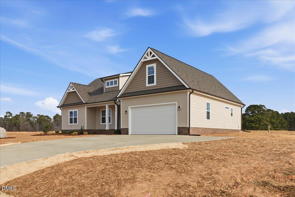 1345 Scarlet Oak Rd Spring Spring Hope, NC 27882 - Photo 3 of 23 a front view of a house with a yard