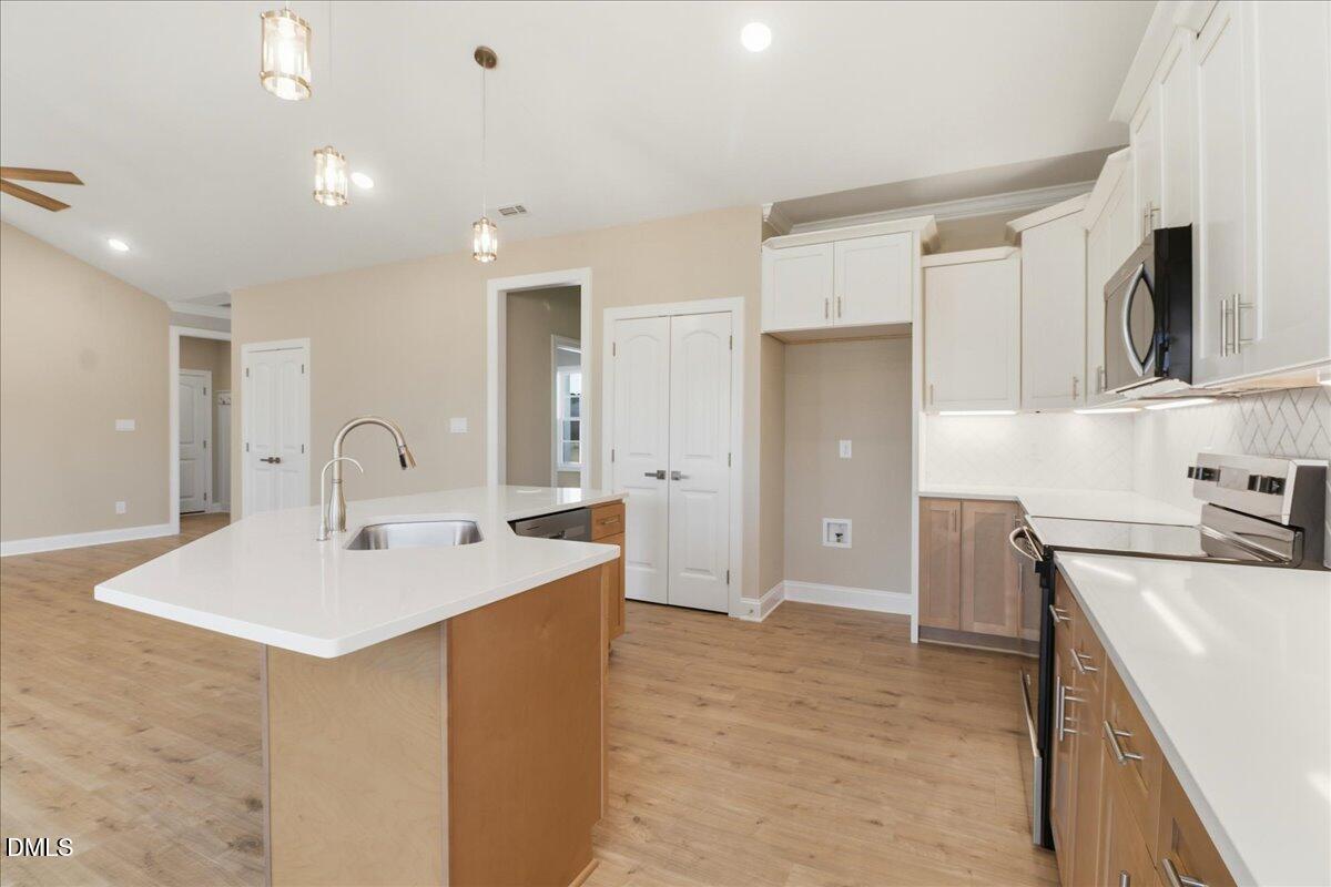 1345 Scarlet Oak Rd Spring Spring Hope, NC 27882 - Photo 9 of 23 a kitchen with a sink a stove and refrigerator
