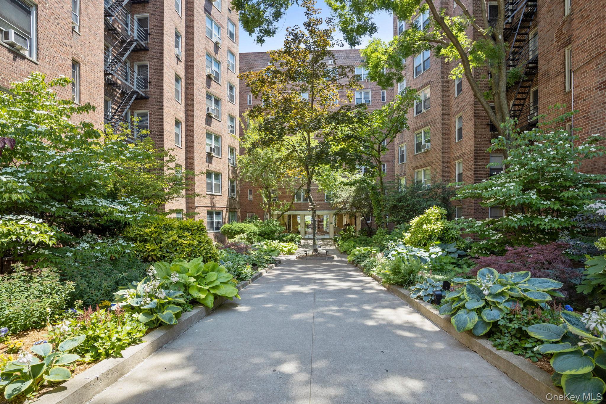 800 Grand Concourse, Unit 2JS Bronx, NY 10451 - Photo 15 of 18 a view of a pathway with a tree