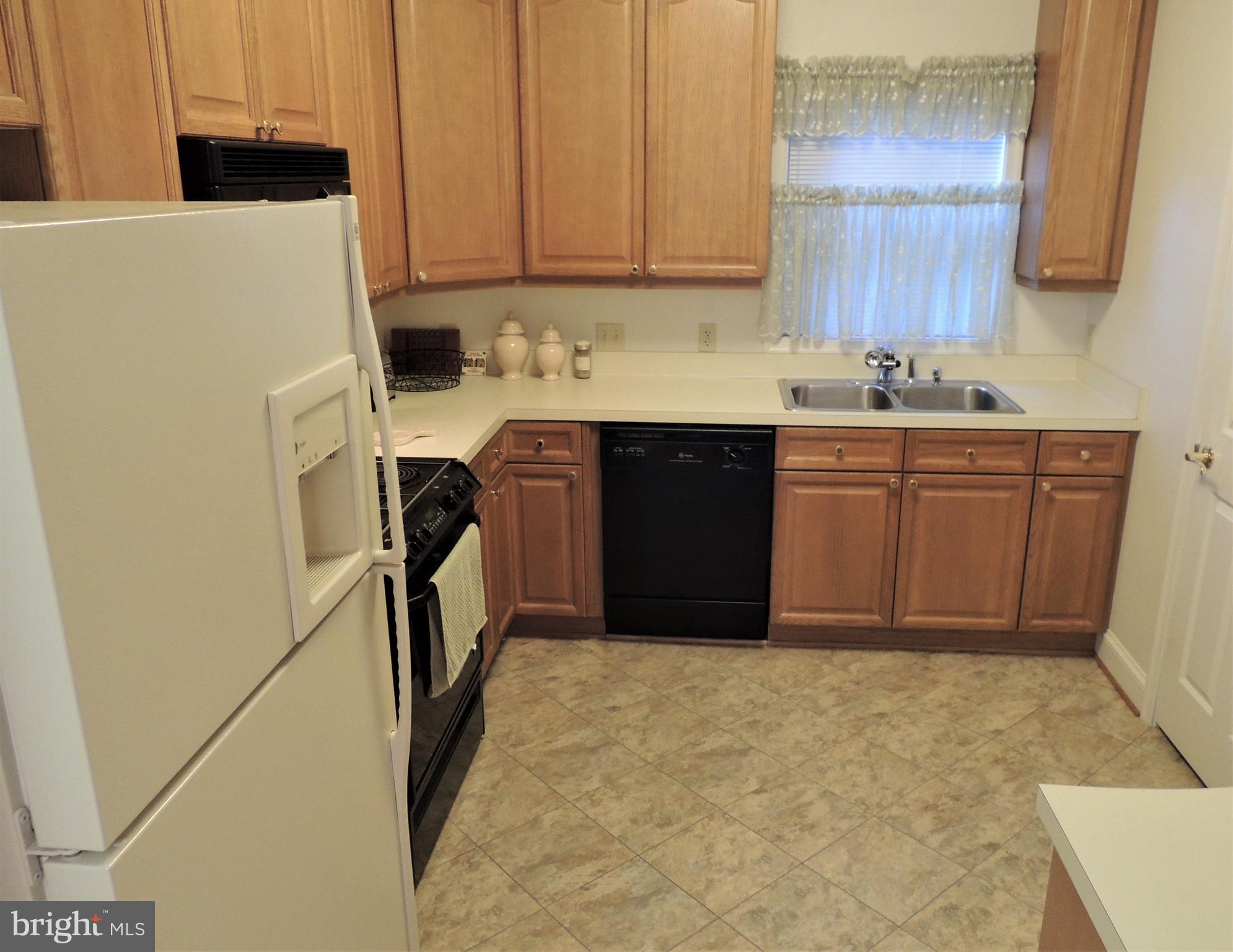 521 Runabout Loop Solomons, MD 20688 - Photo 16 of 33 Kitchen with upgraded flooring