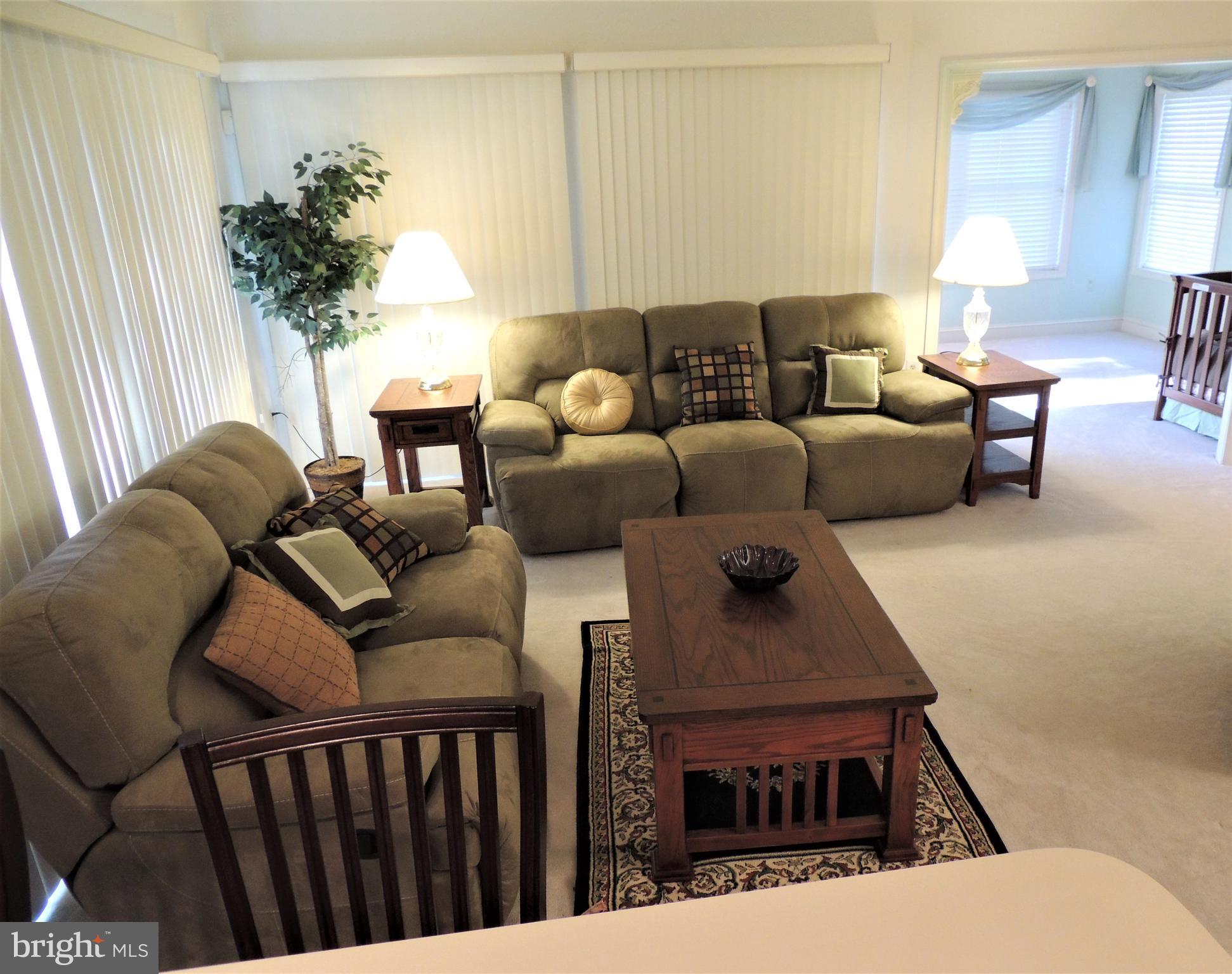 521 Runabout Loop Solomons, MD 20688 - Photo 3 of 33 Living room accesses den/office