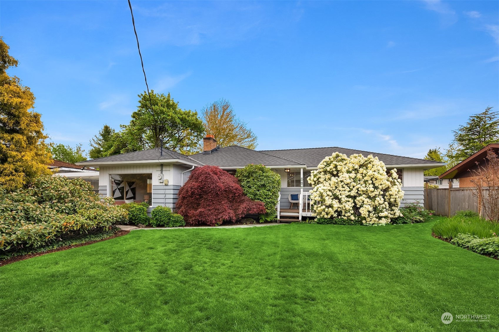 513 South 18th Street Renton, WA 98055 - Photo 1 of 31 a view of a house with a big yard and potted plants