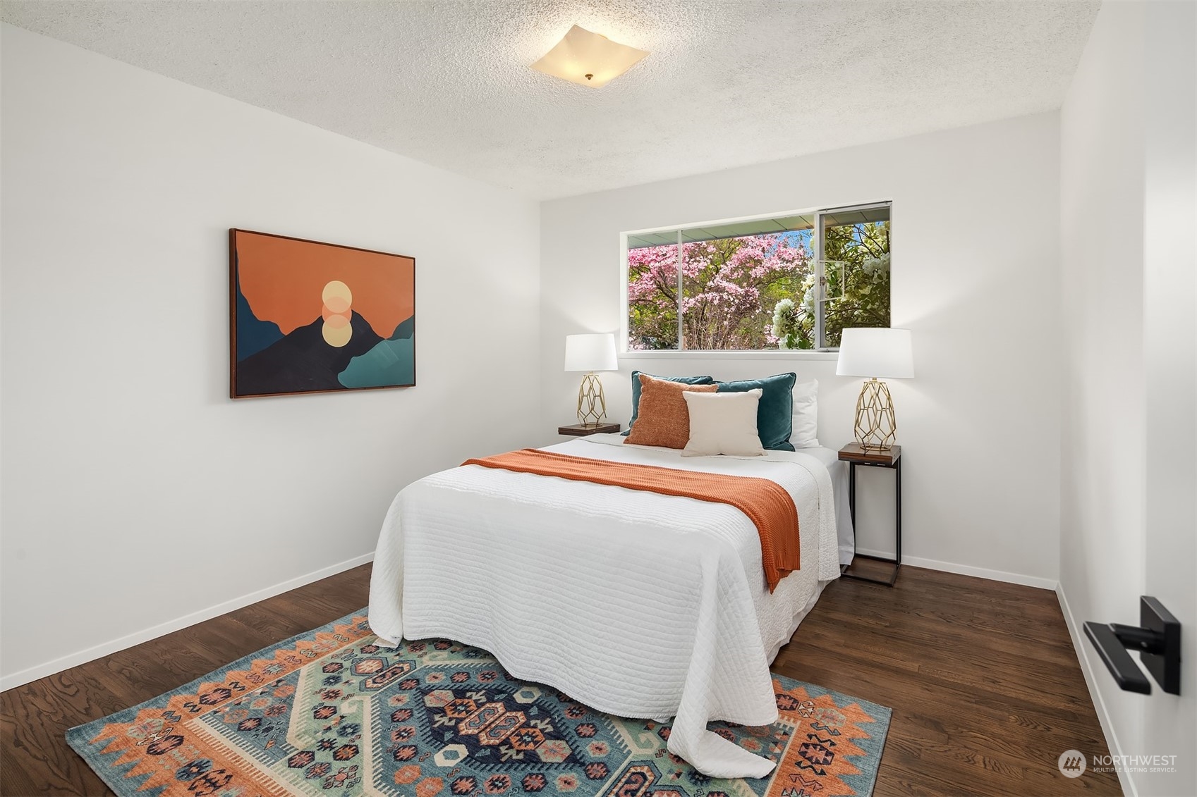 513 South 18th Street Renton, WA 98055 - Photo 21 of 31 a bedroom with a bed and a painting on the wall