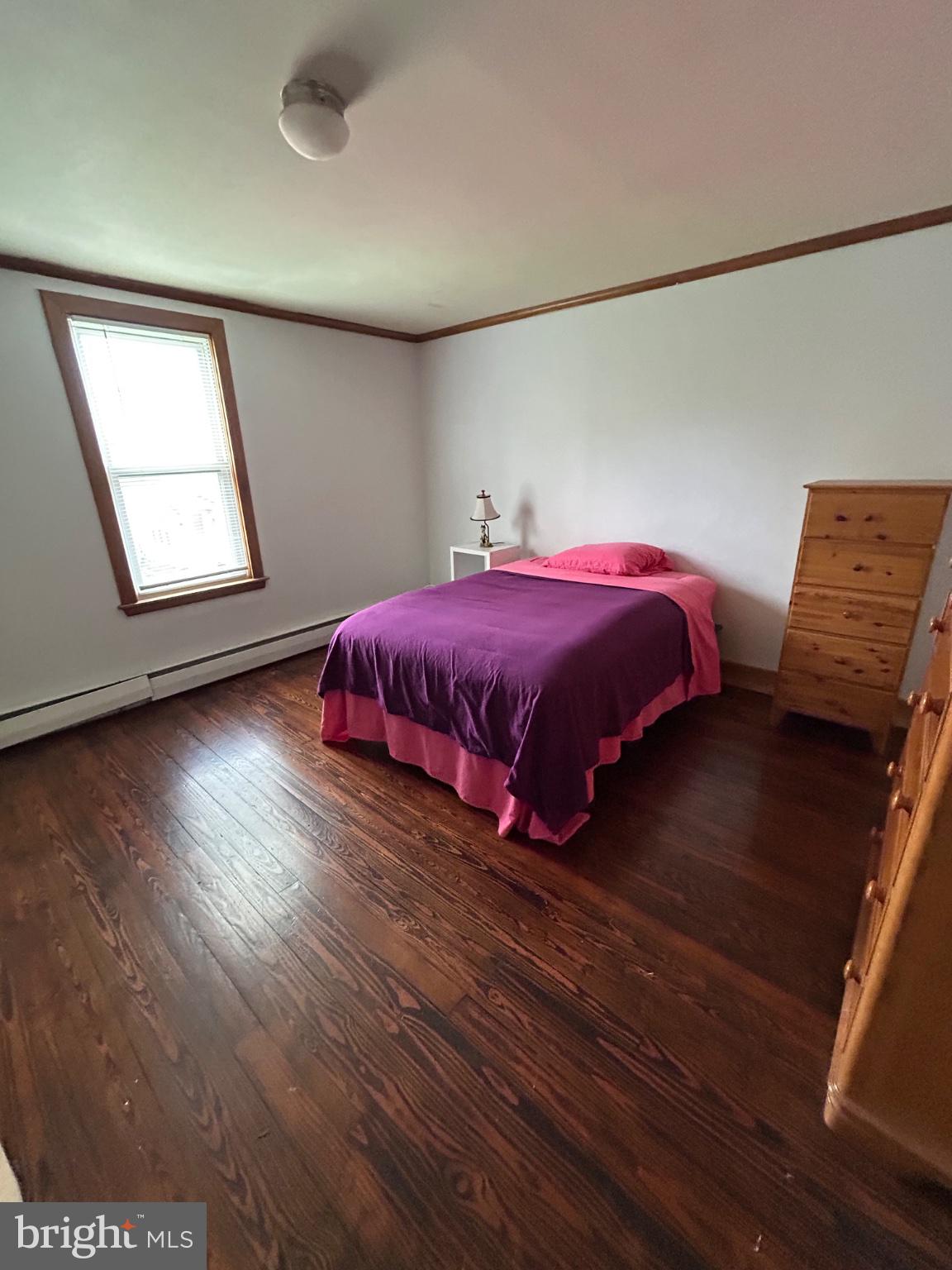 56 Maclay Street Milroy, PA 17063 - Photo 16 of 36 Cozy bedroom with warm wooden floors.