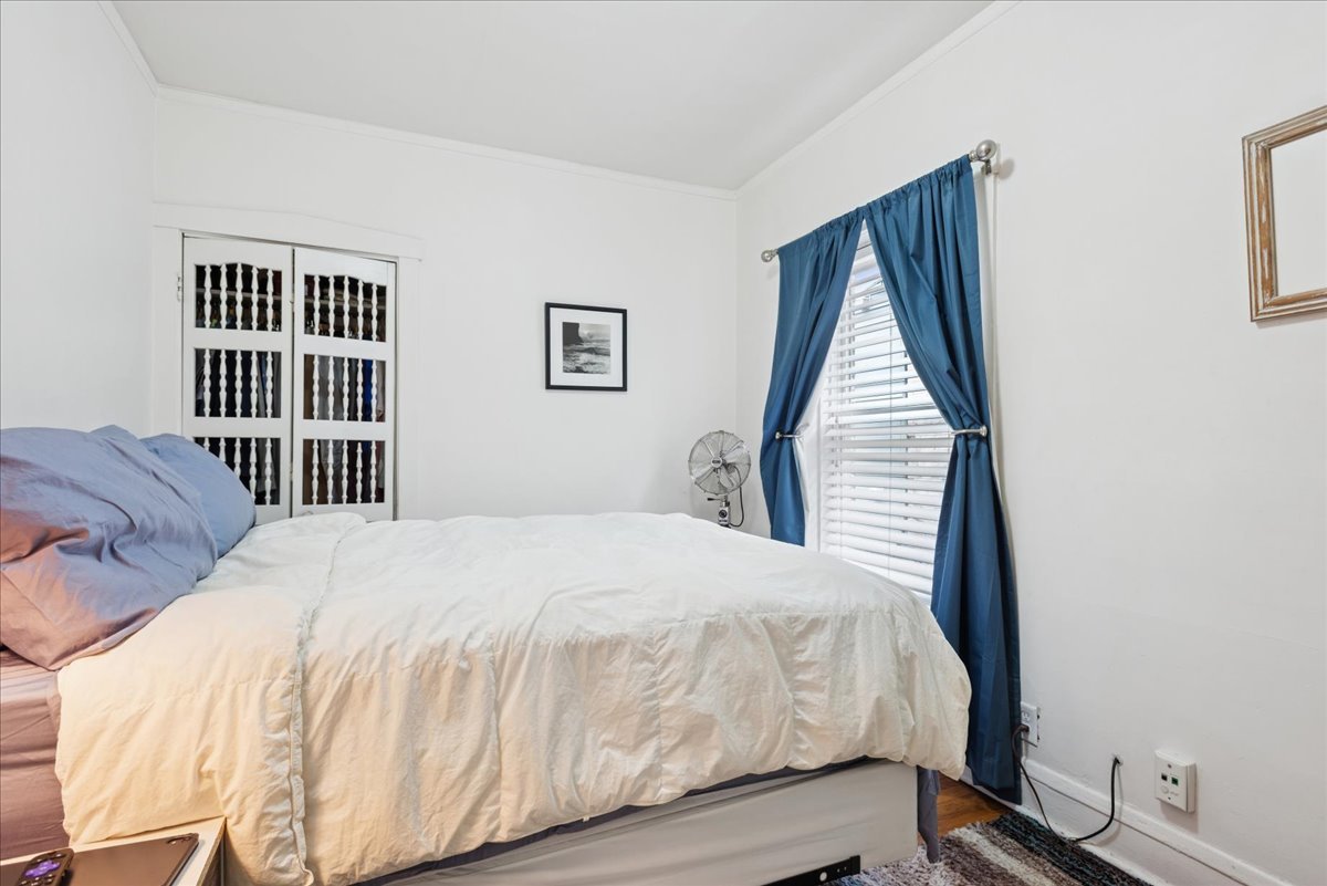 600 Ferdinand Avenue Forest Park, IL 60130 - Photo 6 of 20 a bedroom with a bed and wooden floor