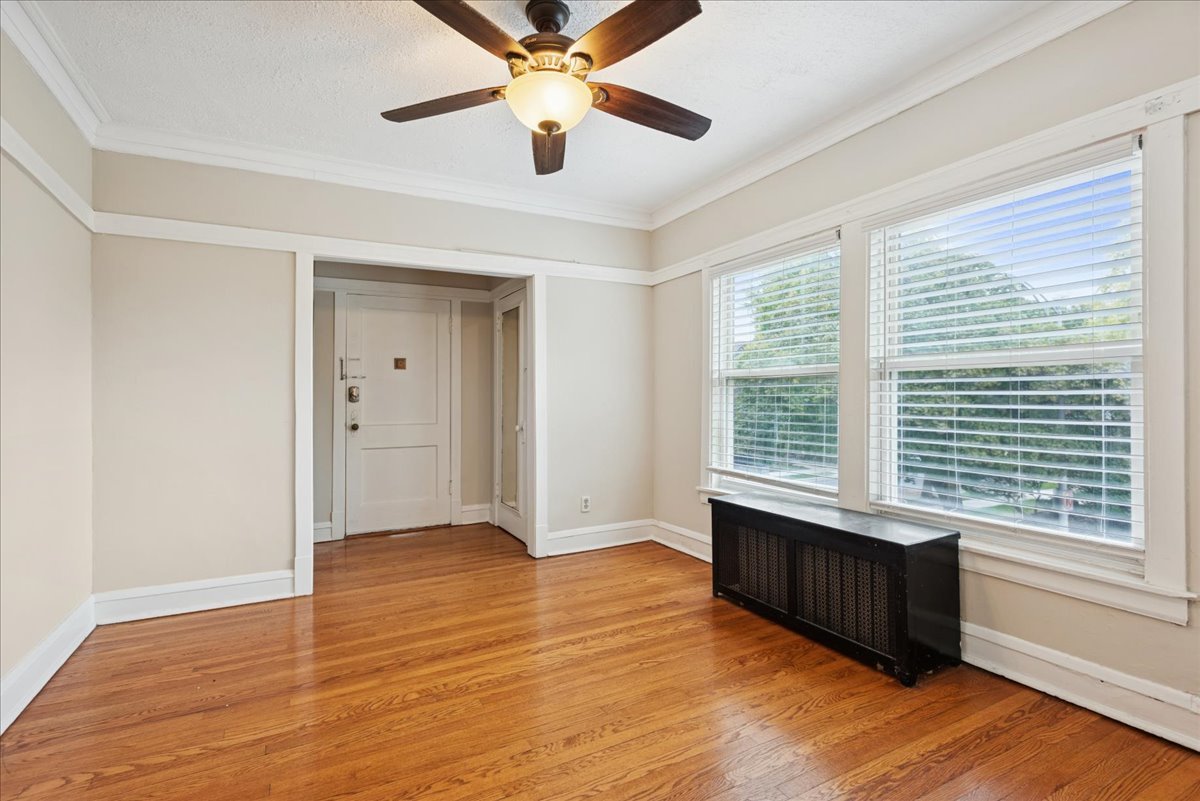 600 Ferdinand Avenue Forest Park, IL 60130 - Photo 9 of 20 a view of an empty room with a window and wooden floor