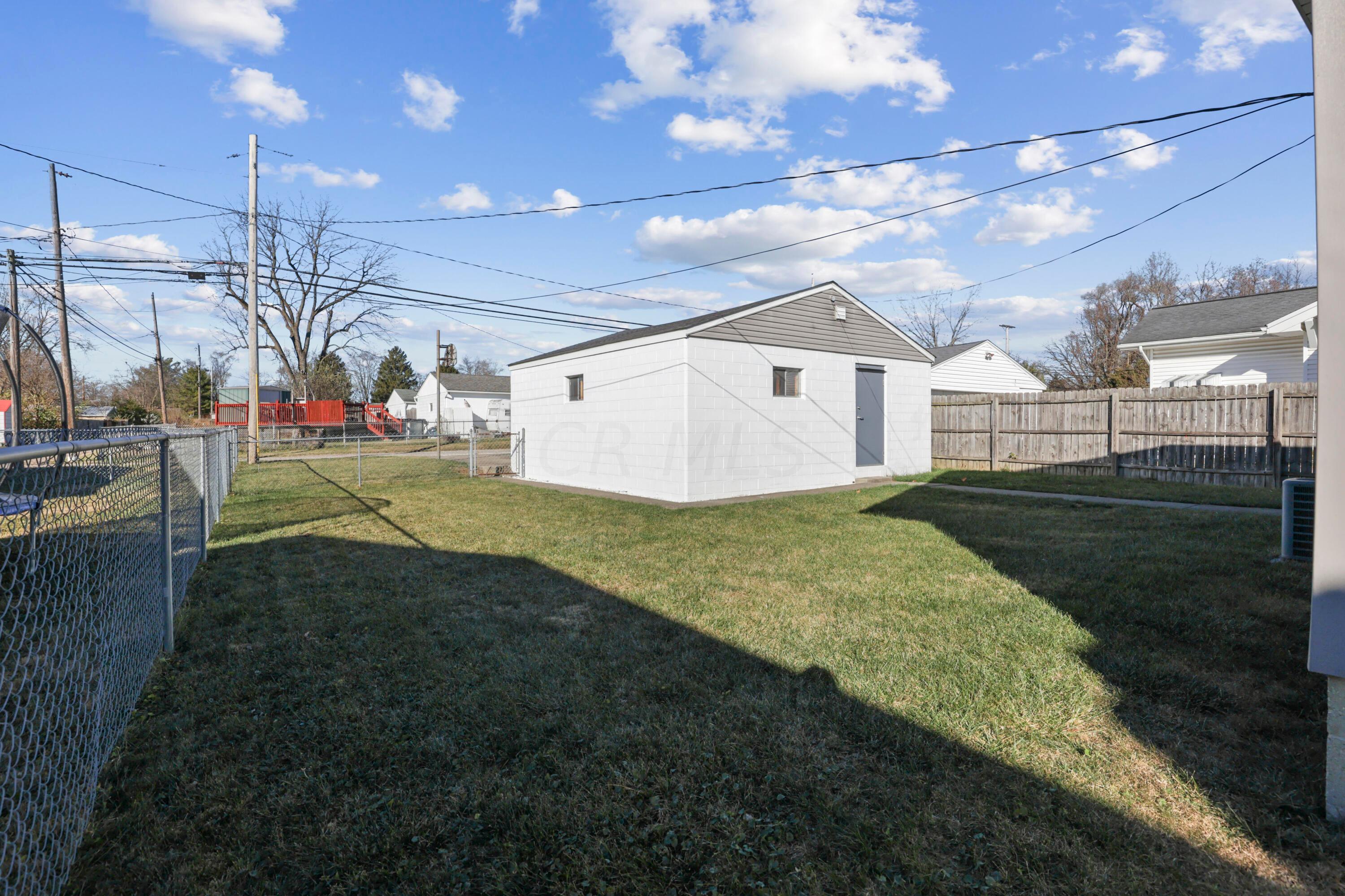 1137 Brown Road Columbus, OH 43223 - Photo 36 of 59 Multiple ways to enter the oversized garage. Nice size yard!