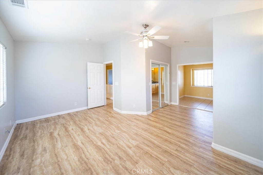 570 Emory Street Imperial Beach, CA 91932 - Photo 22 of 43 a view of an empty room with wooden floor and window