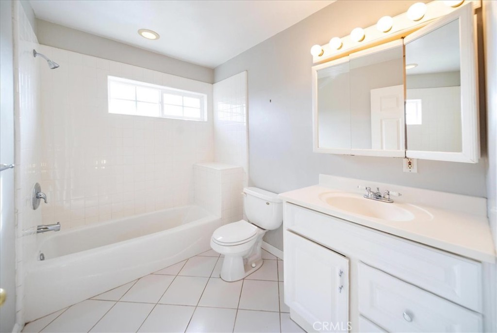 570 Emory Street Imperial Beach, CA 91932 - Photo 23 of 43 a bathroom with a sink a toilet and shower