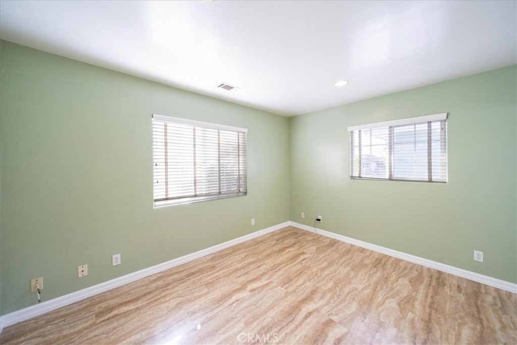 570 Emory Street Imperial Beach, CA 91932 - Photo 25 of 43 a view of empty room with wooden floor and fan