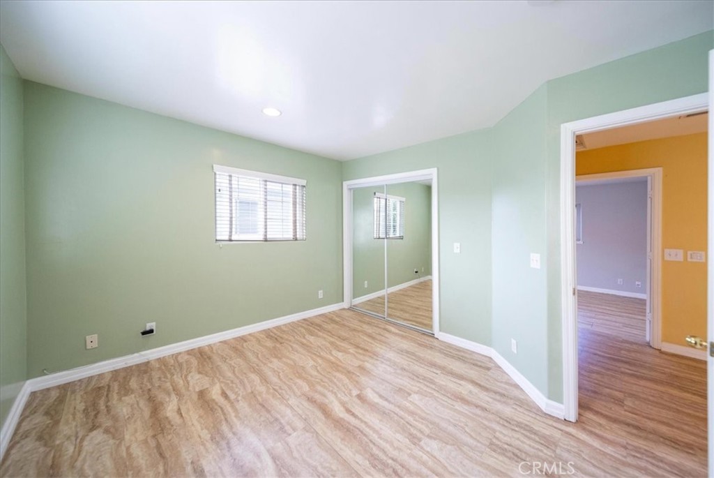 570 Emory Street Imperial Beach, CA 91932 - Photo 26 of 43 a view of a room with wooden floor and window