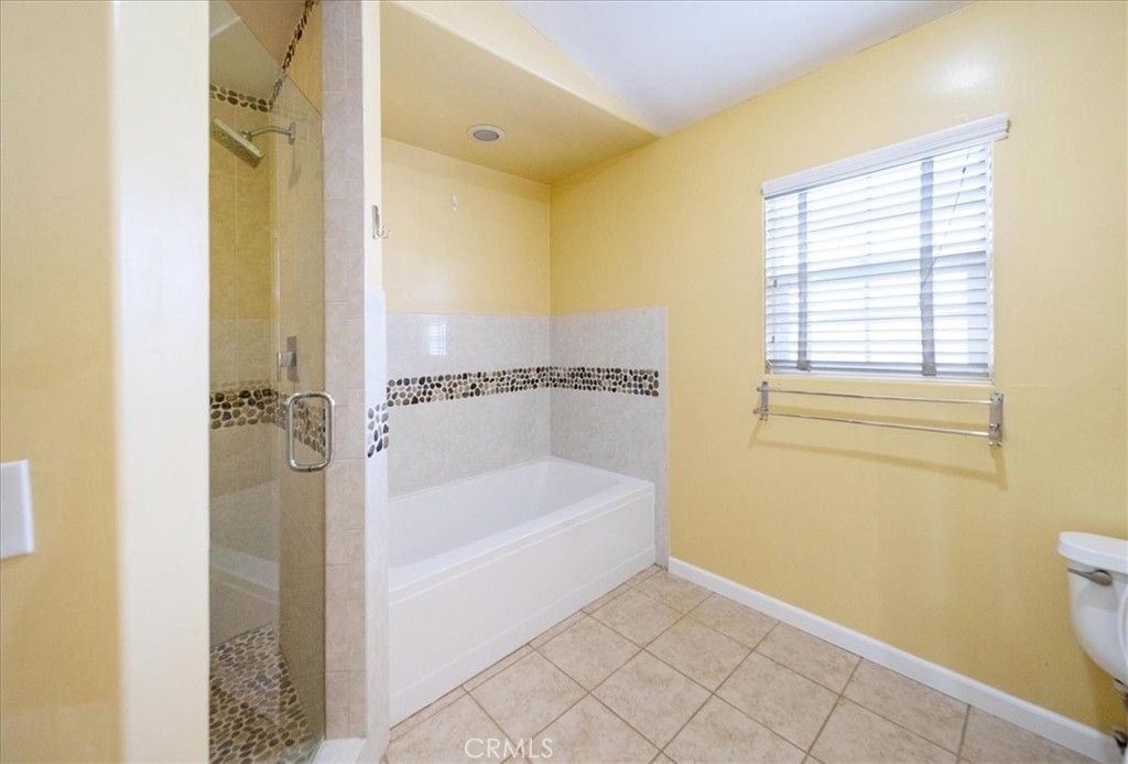 570 Emory Street Imperial Beach, CA 91932 - Photo 31 of 43 a bathroom with a bathtub and a shower