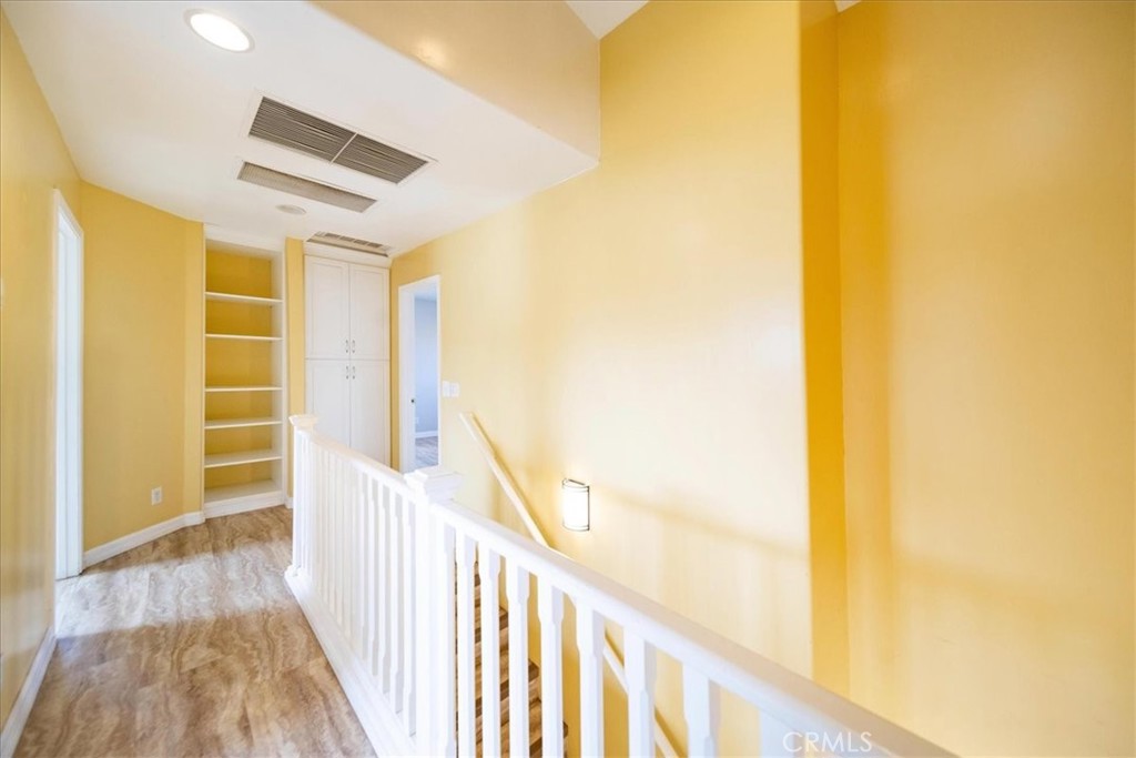 570 Emory Street Imperial Beach, CA 91932 - Photo 33 of 43 a view of a hallway with wooden floor and a bathroom