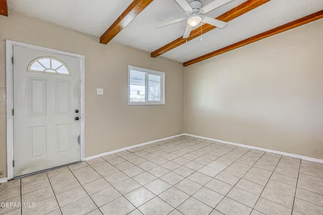 a view of a livingroom with wooden floor and a window