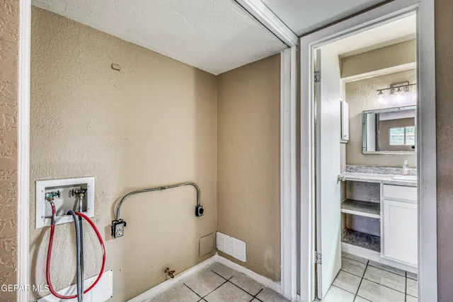 a bathroom with a glass shower door and a sink
