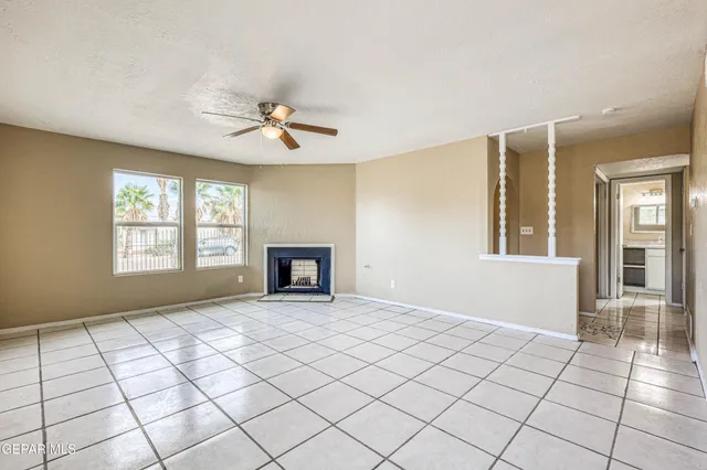 a kitchen with cabinets appliances and a window