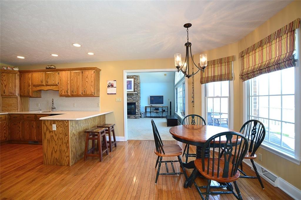 108 Cloverleaf Lane Butler, PA 16001 - Photo 13 of 25 This view shows the practicality of family life for a quick snack or meal, or just a couple semi-private areas to surf at. Recessed & hanging lighting keeps the environment 'just right'.