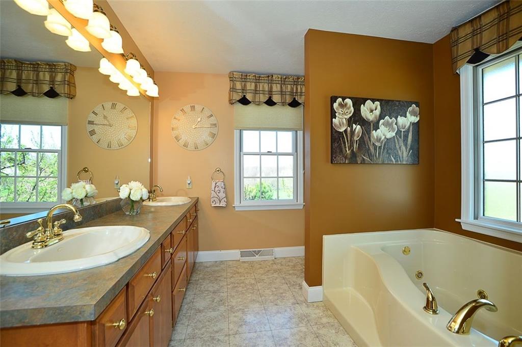108 Cloverleaf Lane Butler, PA 16001 - Photo 16 of 25 MAIN FLOOR MASTER En Suite. Double Vanity w/ large mirror. Window over the jet tub is a privacy glass so the light gets in yet keeps your special times of relaxing, private.