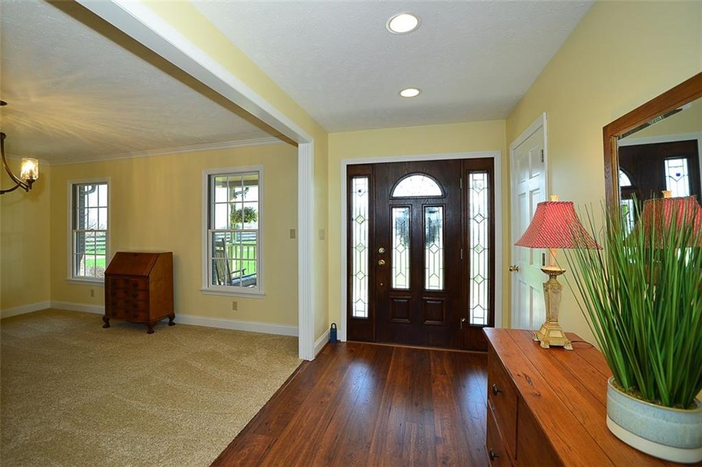 108 Cloverleaf Lane Butler, PA 16001 - Photo 7 of 25 Beautiful Entryway features a gorgeous entryway door, new wood flooring, new carpeting, new paint & recessed lights.