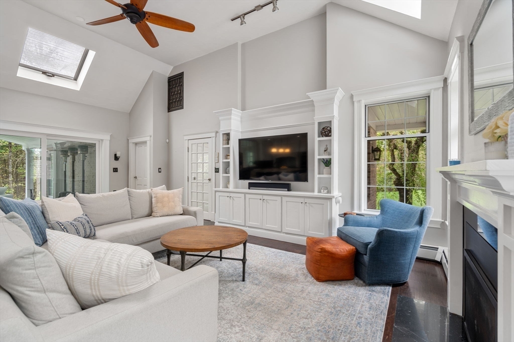 358 Cartwright Road Needham, MA 02492 - Photo 11 of 35 a living room with furniture fireplace and flat screen tv