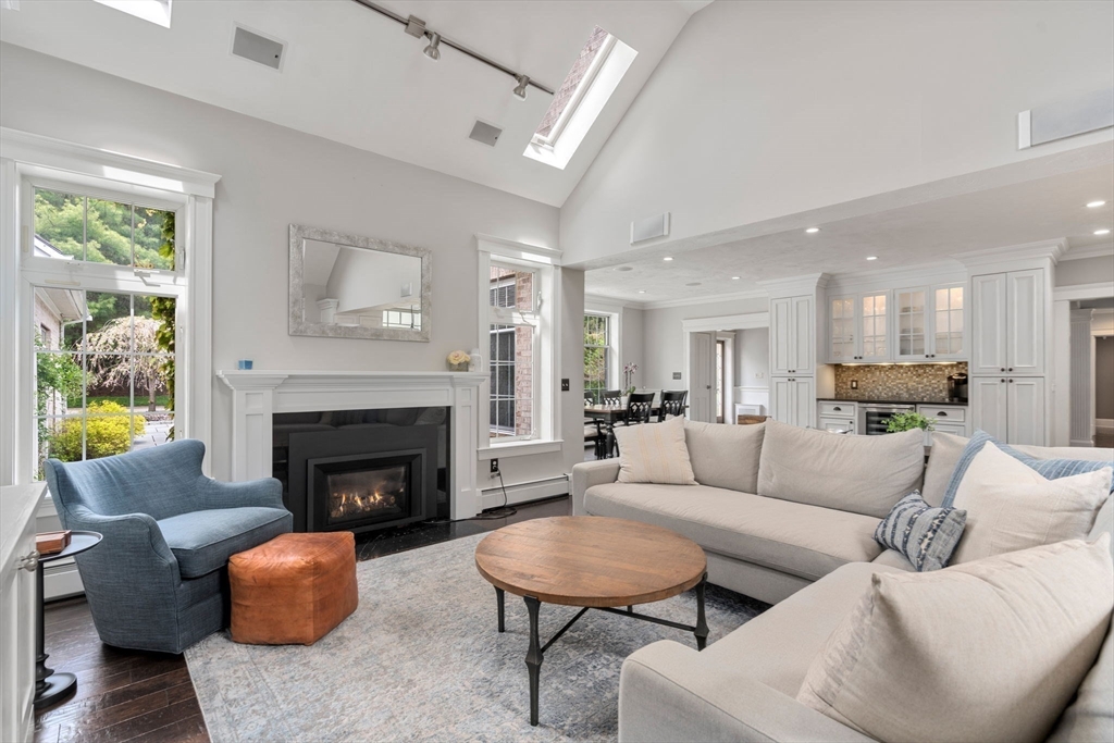 358 Cartwright Road Needham, MA 02492 - Photo 12 of 35 a living room with furniture and a fireplace