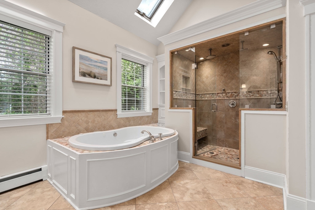 358 Cartwright Road Needham, MA 02492 - Photo 19 of 35 a white bath tub sitting in a bathroom next to a window