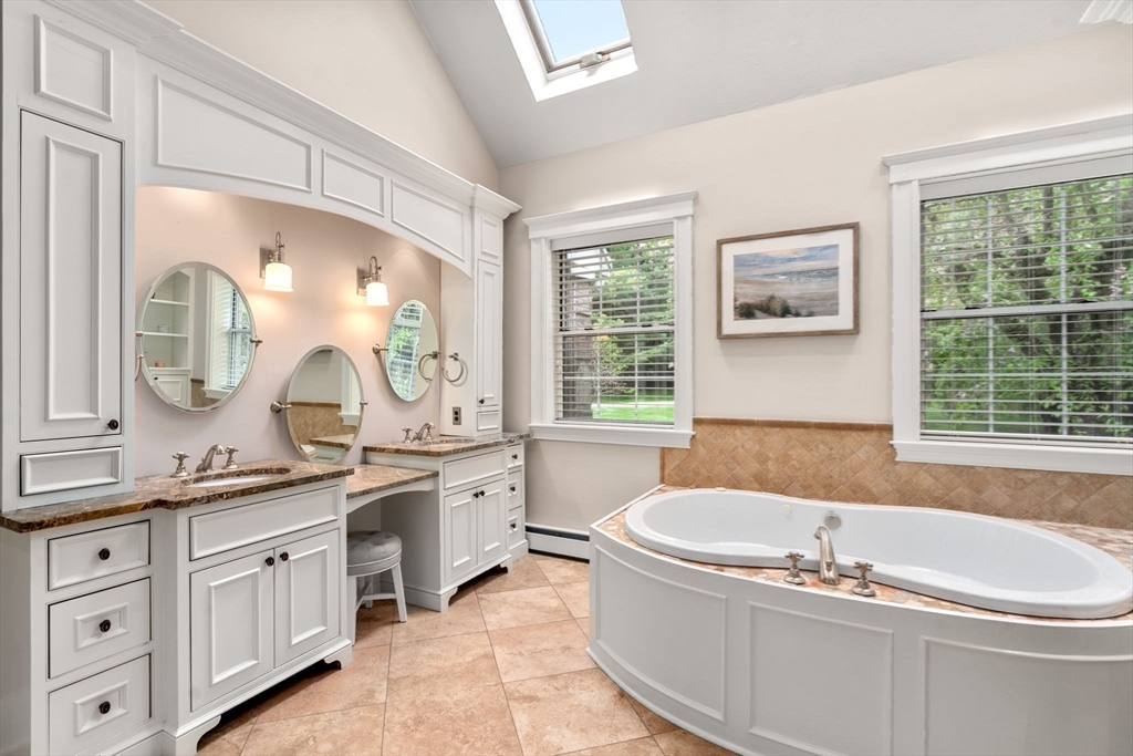 358 Cartwright Road Needham, MA 02492 - Photo 20 of 35 a bath tub sitting next to a bathroom sink