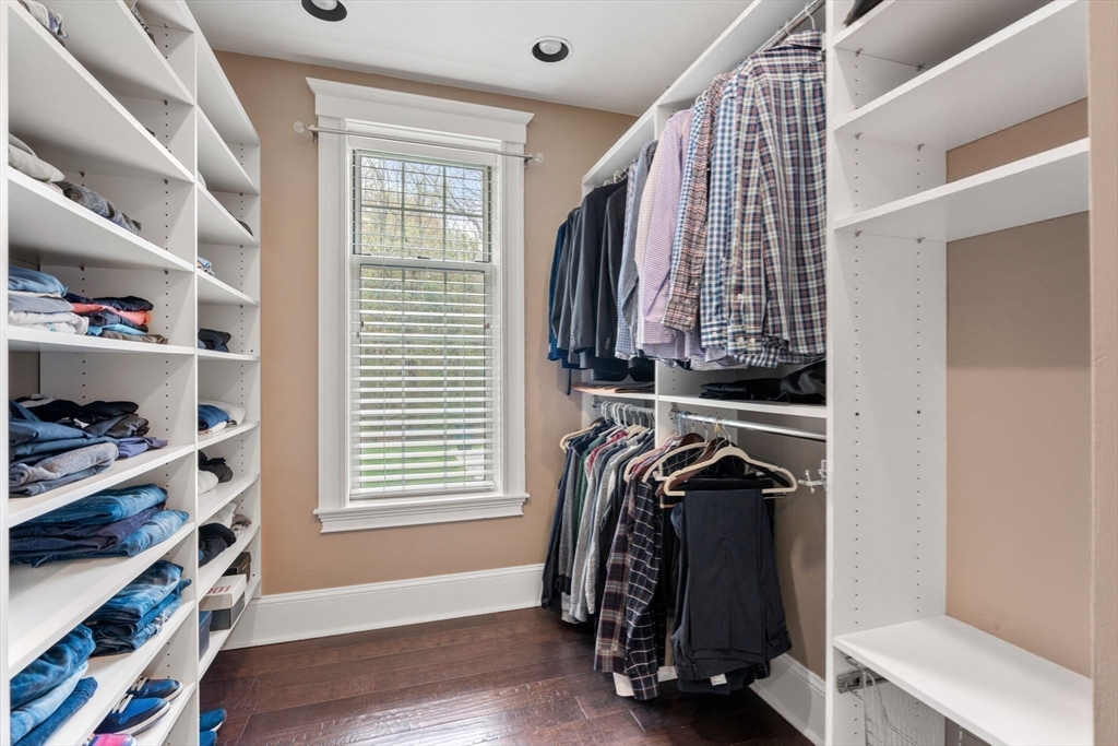 358 Cartwright Road Needham, MA 02492 - Photo 21 of 35 a view of walk in closet with clothes and shoes