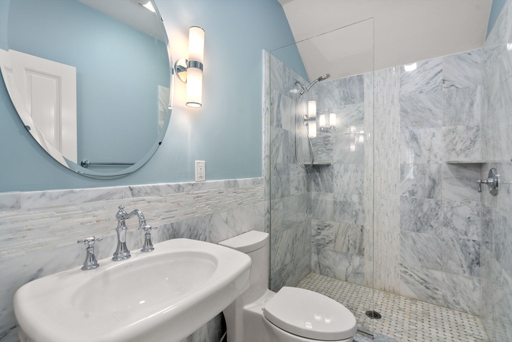 358 Cartwright Road Needham, MA 02492 - Photo 24 of 35 a bathroom with a sink a toilet and shower