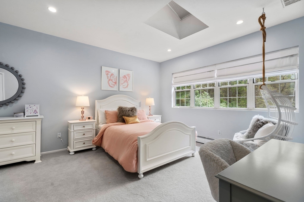 358 Cartwright Road Needham, MA 02492 - Photo 25 of 35 a bedroom with a bed and a couch