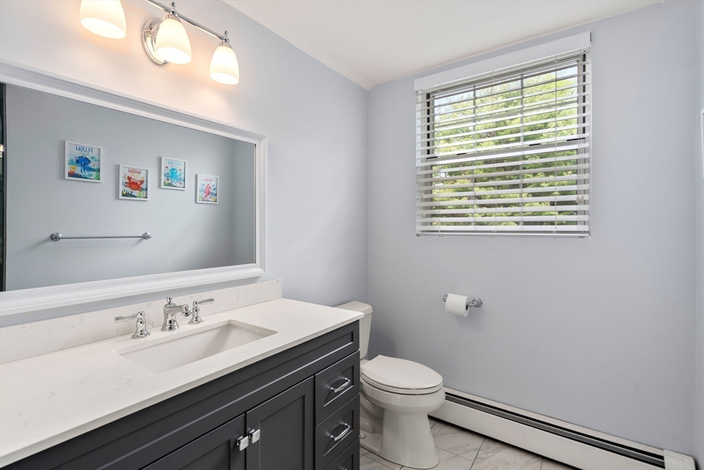 358 Cartwright Road Needham, MA 02492 - Photo 28 of 35 a bathroom with a sink vanity and a toilet