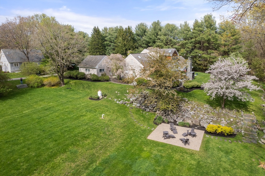 358 Cartwright Road Needham, MA 02492 - Photo 35 of 35 a backyard of a house with lots of green space