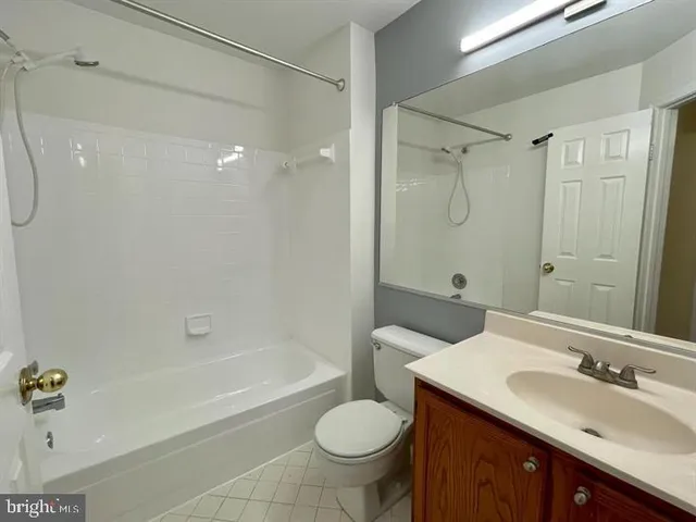 a bathroom with a sink toilet tub and shower