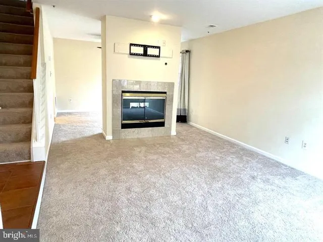 an empty room with a fireplace