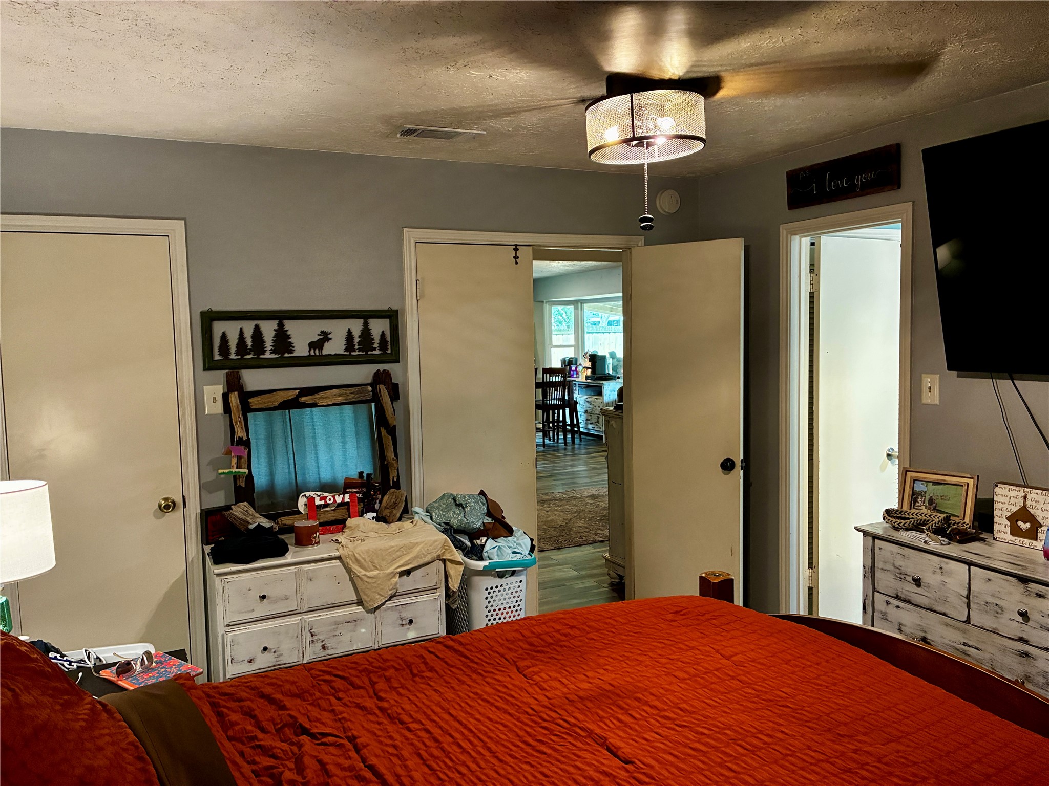 2 Sarita Road Angleton, TX 77515 - Photo 9 of 21 a bedroom with a bed and a flat screen tv