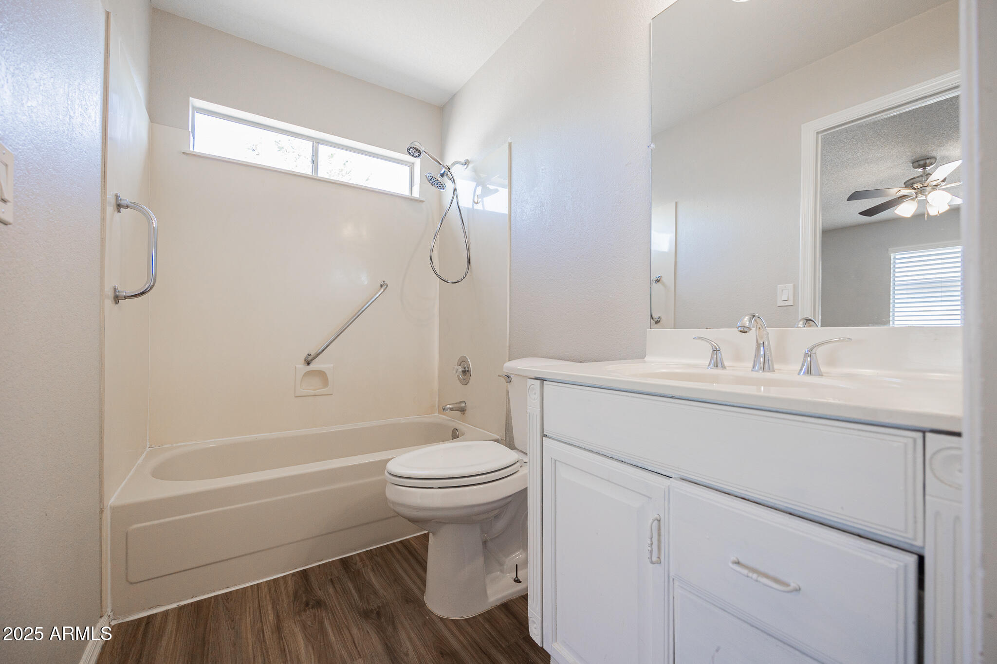 619 East Jensen Street, Unit 42 Mesa, AZ 85203 - Photo 15 of 24 a bathroom with a sink toilet and shower