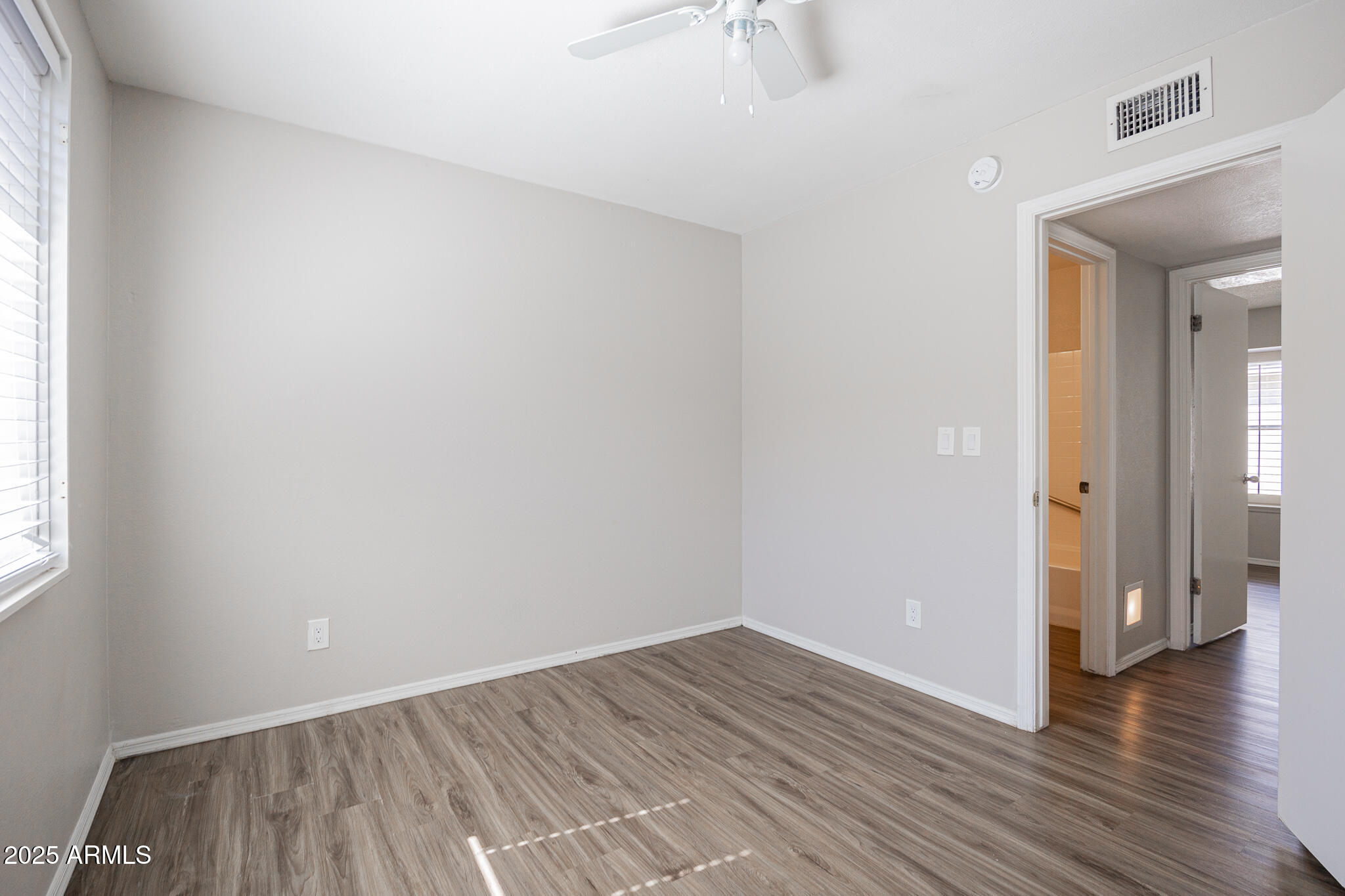 619 East Jensen Street, Unit 42 Mesa, AZ 85203 - Photo 17 of 24 wooden floor in an empty room