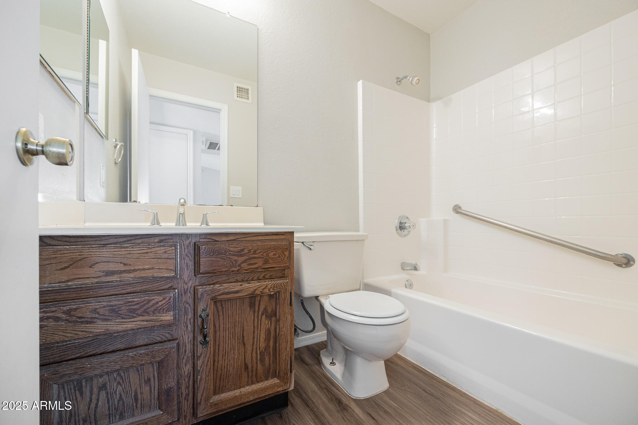 619 East Jensen Street, Unit 42 Mesa, AZ 85203 - Photo 18 of 24 a bathroom with a sink toilet and shower