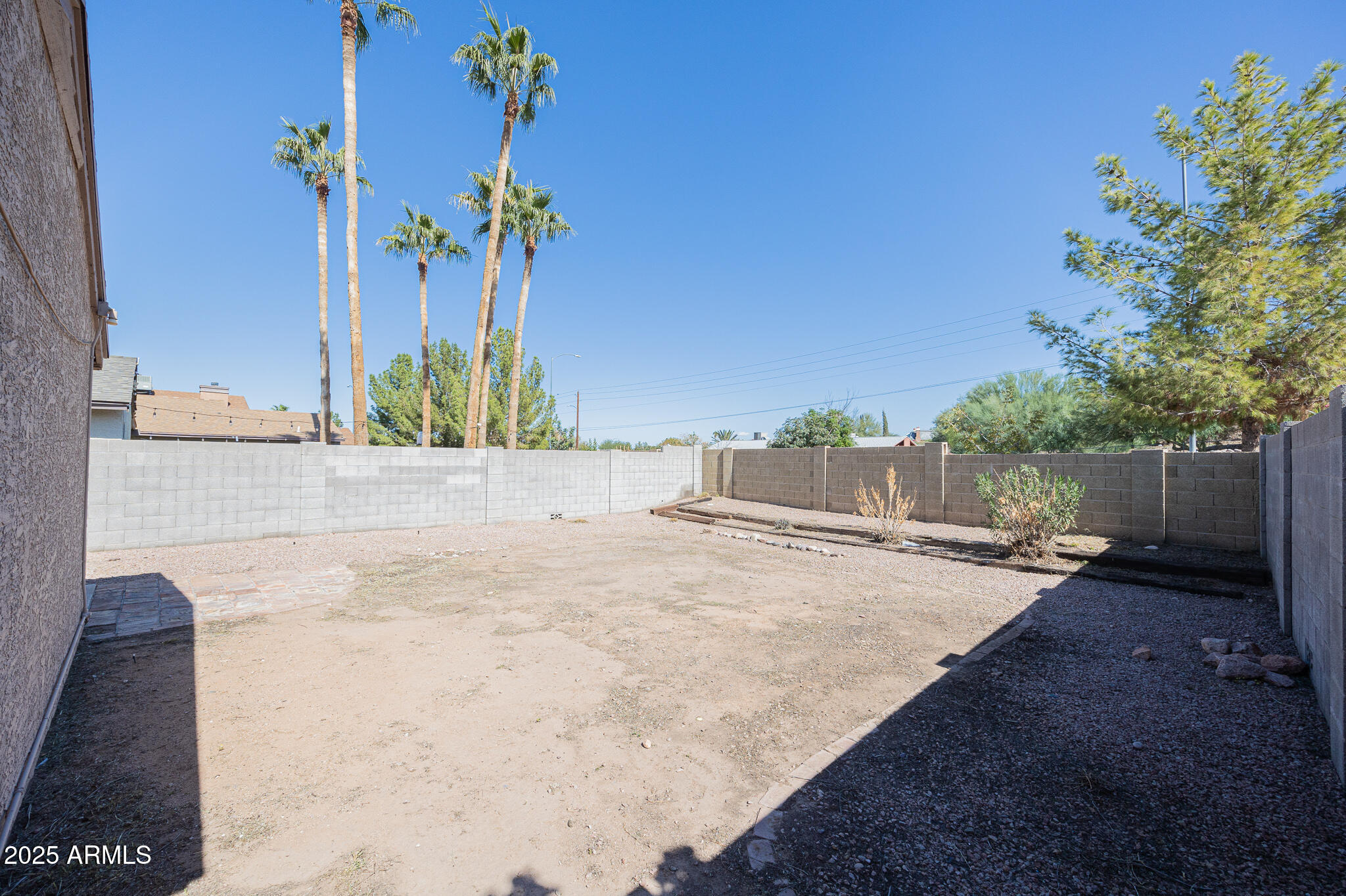 619 East Jensen Street, Unit 42 Mesa, AZ 85203 - Photo 24 of 24 a view of a house with a yard and garage